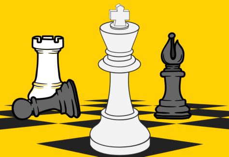 Black and white chess pieces on a dark yellow background